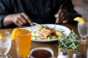 Pan-Seared Salmon being cut into to enjoy